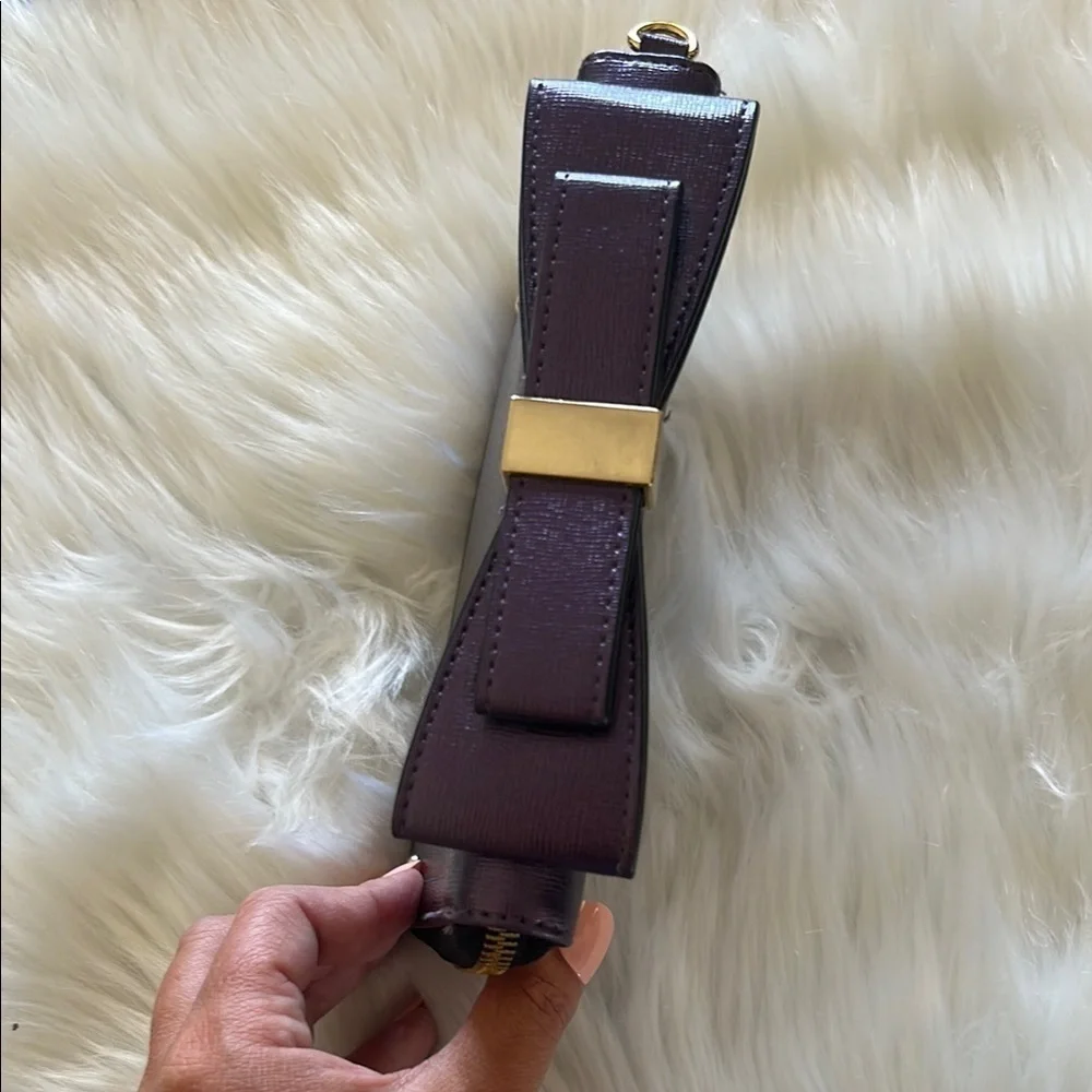 ALDO Purple Shimmer Wallet with Gold Hardware and Bow Detail